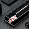 black crocodile-textured leather stationery box with spaces for pens, stamps, paper clips, etc.