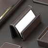 brown leather business card holder with white stitched trim