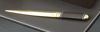 letter opener with brown leather handle and gold-plated brass blade