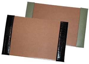crocodile-grain leather desk pads, shown in jade pebble lizard and black alligator leather