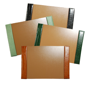 crocodile-grain leather desk pads, shown in black, jade, hunter and luaggage leather